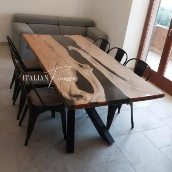 Tavolo in legno massello di noce europeo con inserto centrale in resina azzurra pigmentata effetto 3D, finitura lucida e bordi naturali vivi.